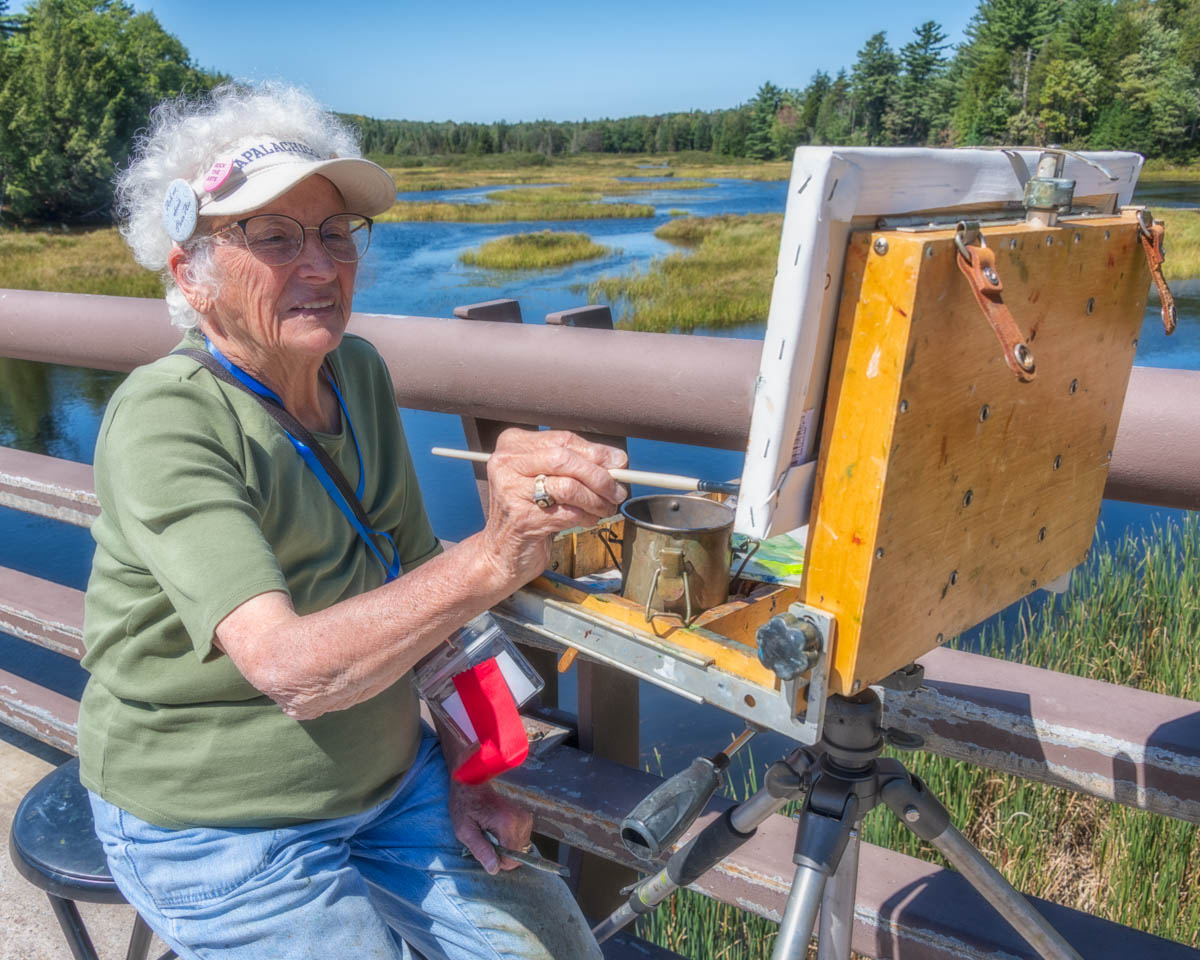 Judy Soprano painting across from the Mill